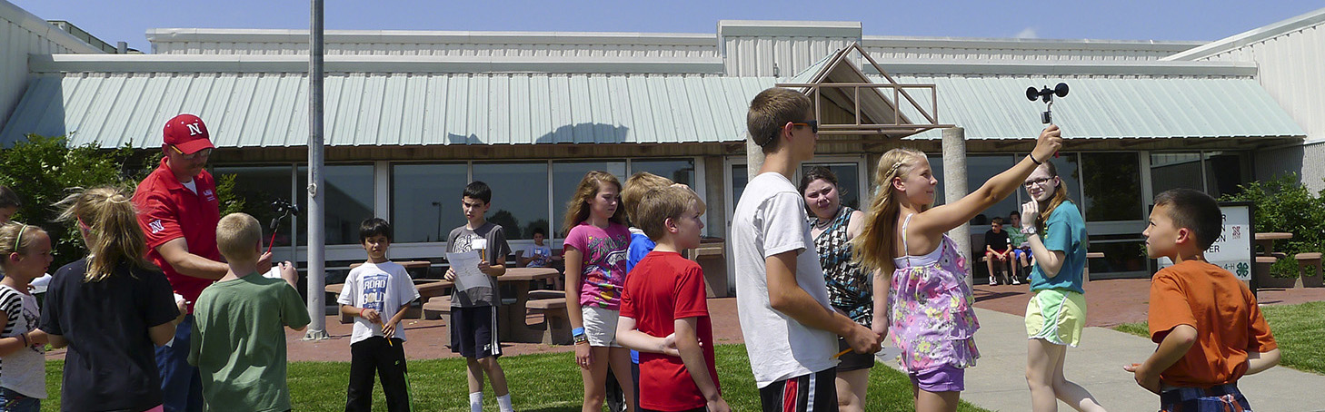 group of youth doing a wind experiment