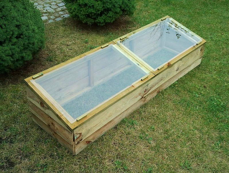 Image of a simple wooden coldframe. 