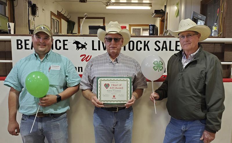 Three men with Heart of 4-H Award certificate