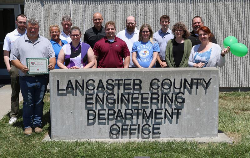 Lancaster County Engineering Department outside by their office sign