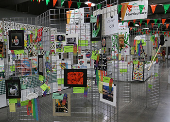 display at a fair with Clover Kids artwork