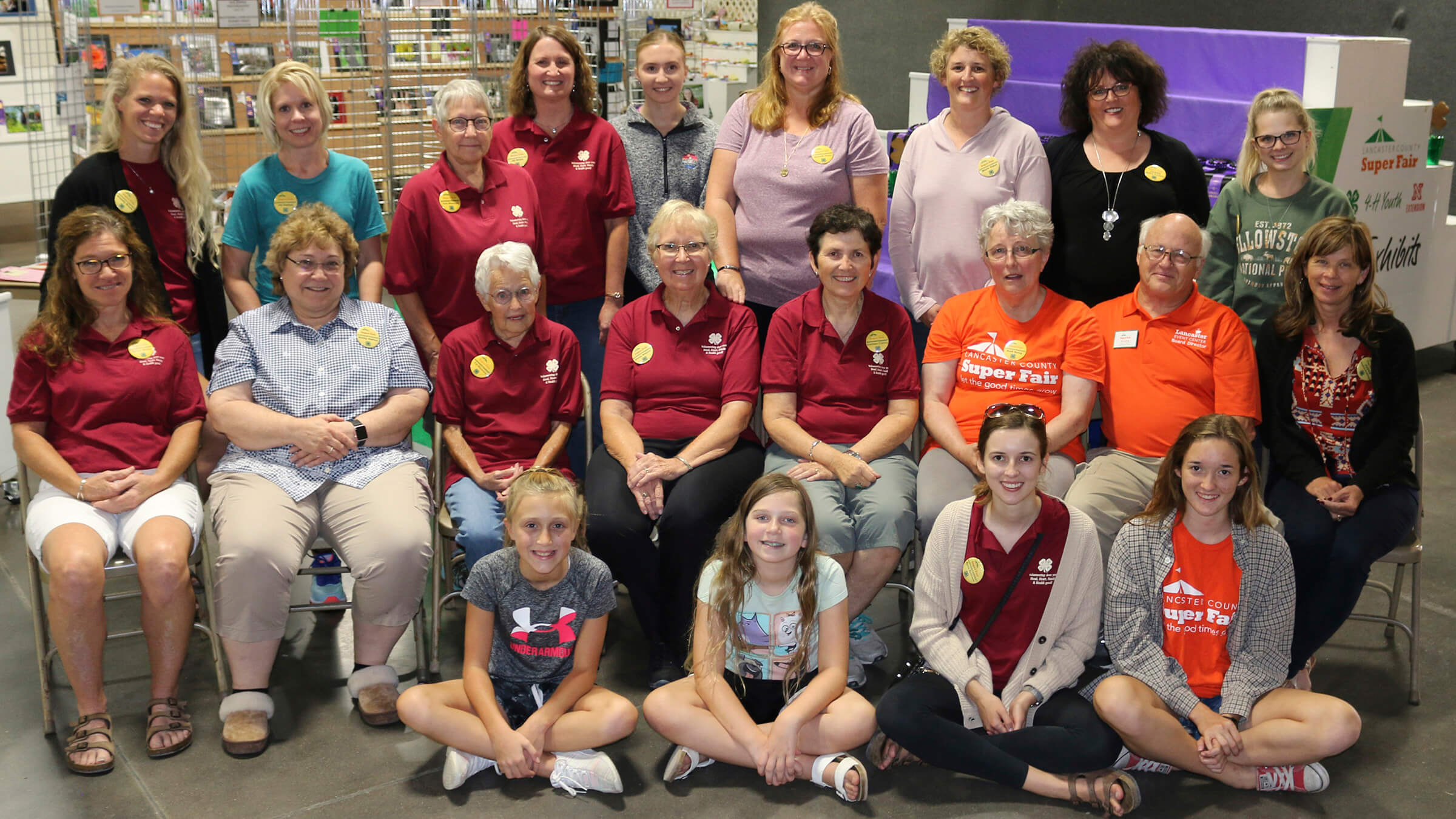 A group of people in three rows, several wearing red 4-H polo shirts