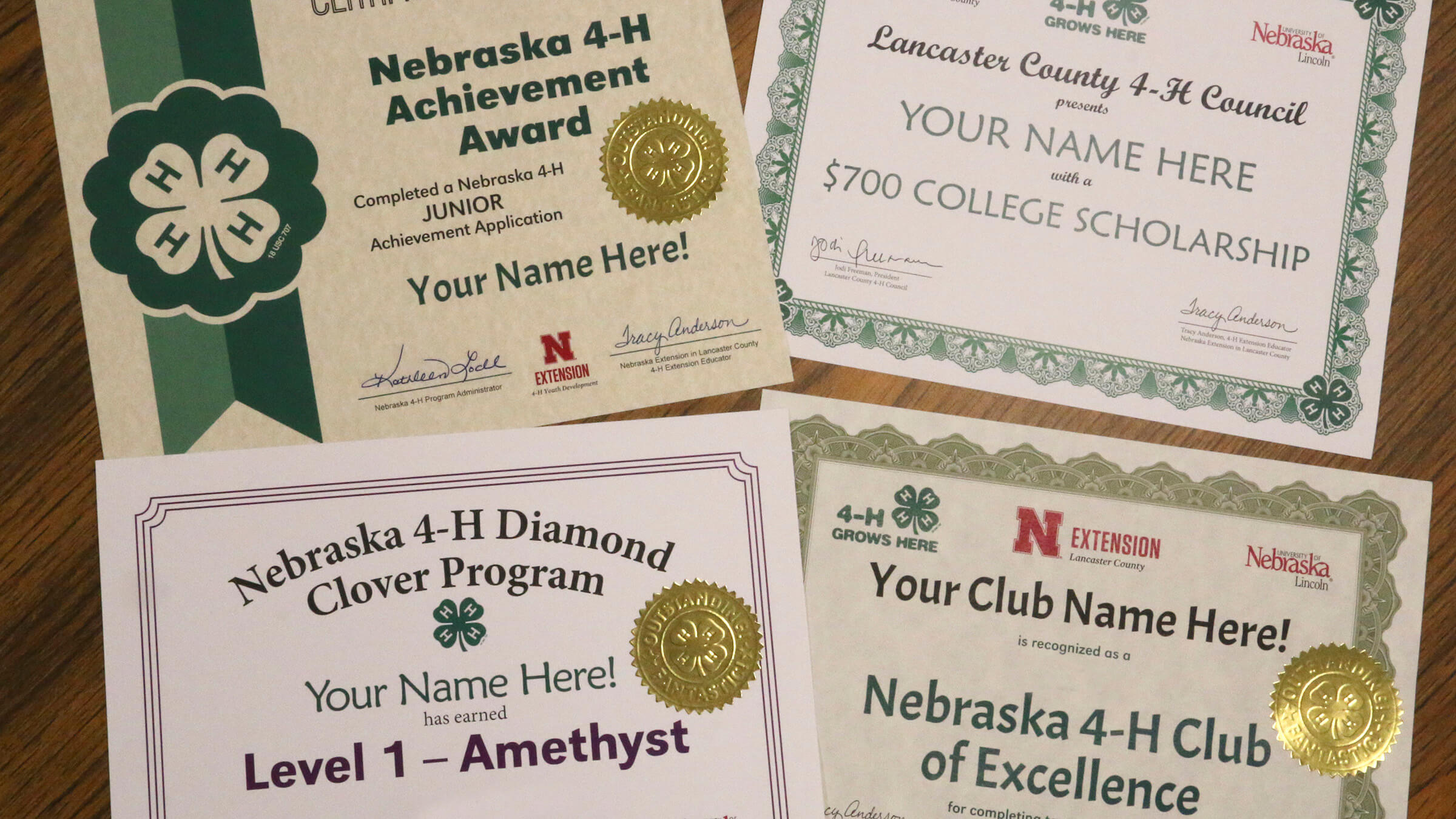 four different 4-H Certificates that say "Your Name Here"