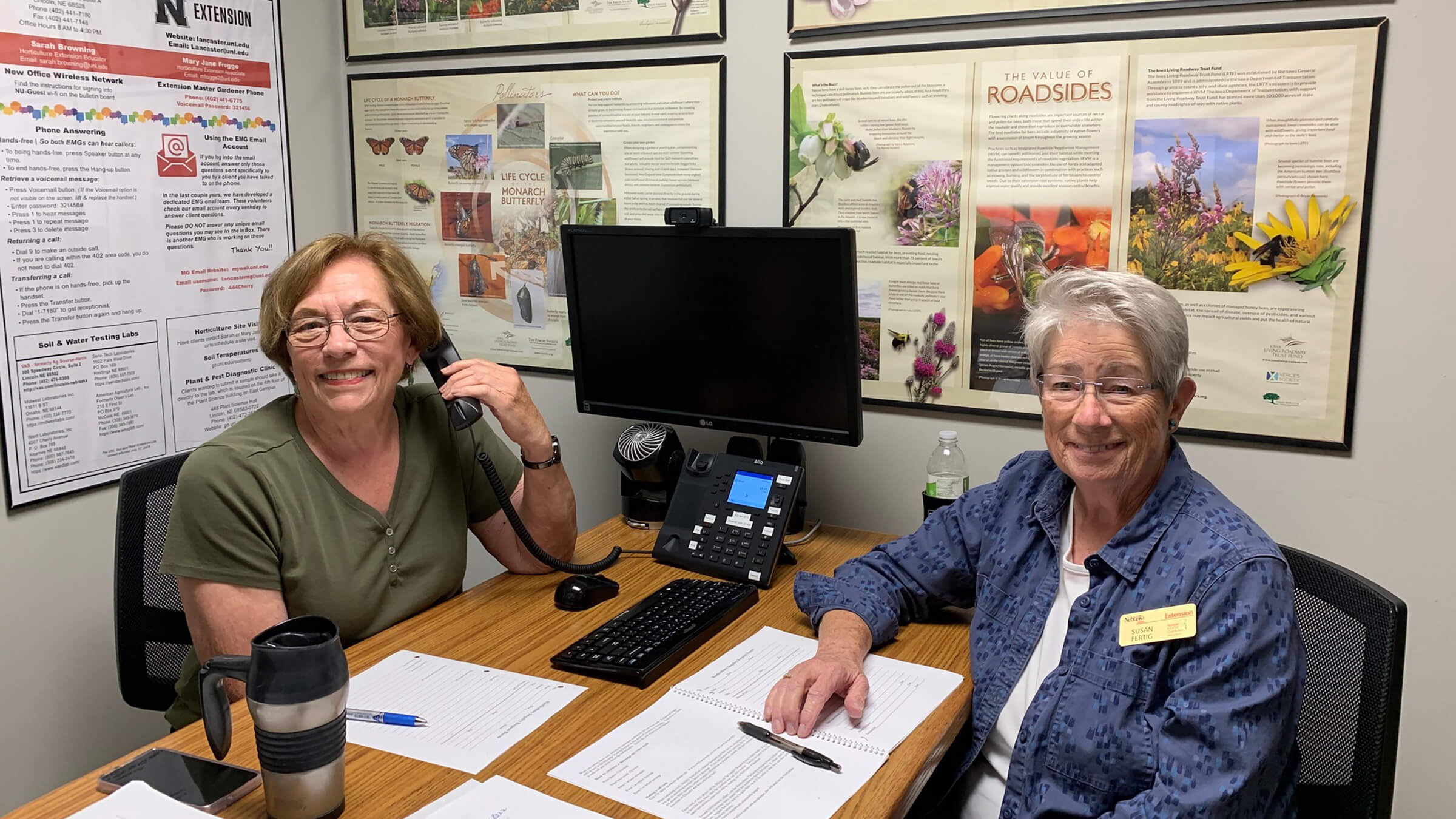 Image of Elaine and Susan answering phones in 2023. 