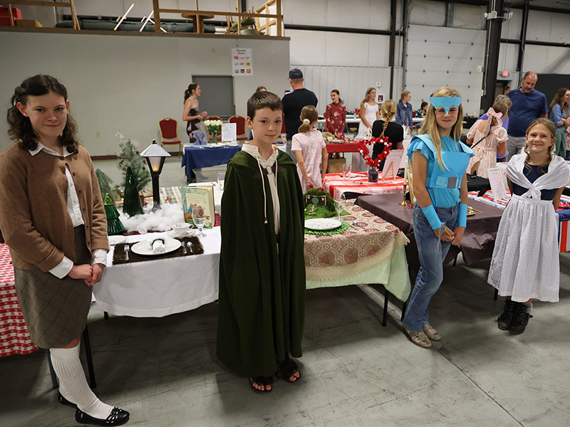 Image of 4-H exhibitors with their exhibits during the Table Setting Contest during Lancaster County Super Fair 2025