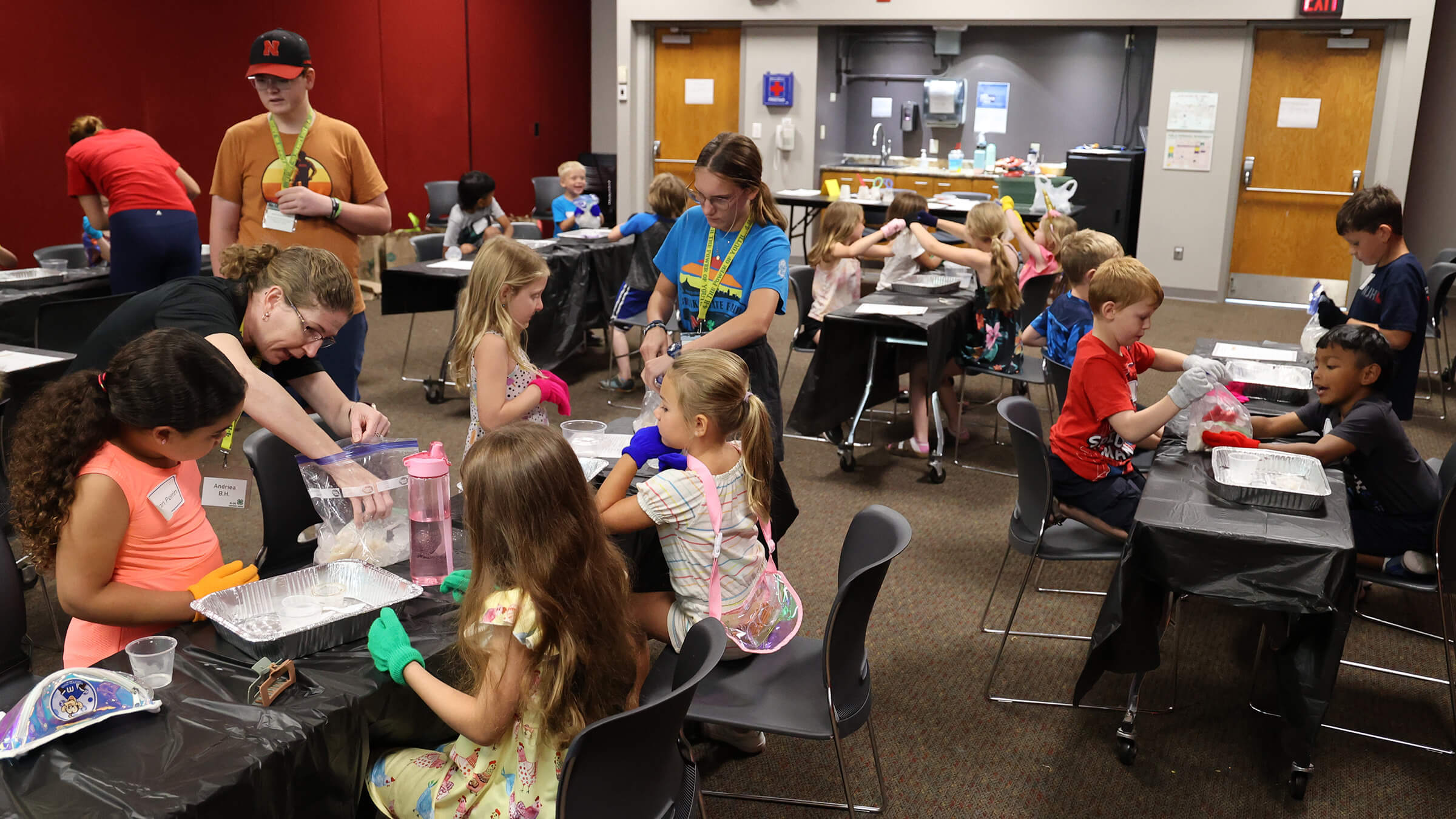 image of youth making ice cream during workshop at 4-H Clover College