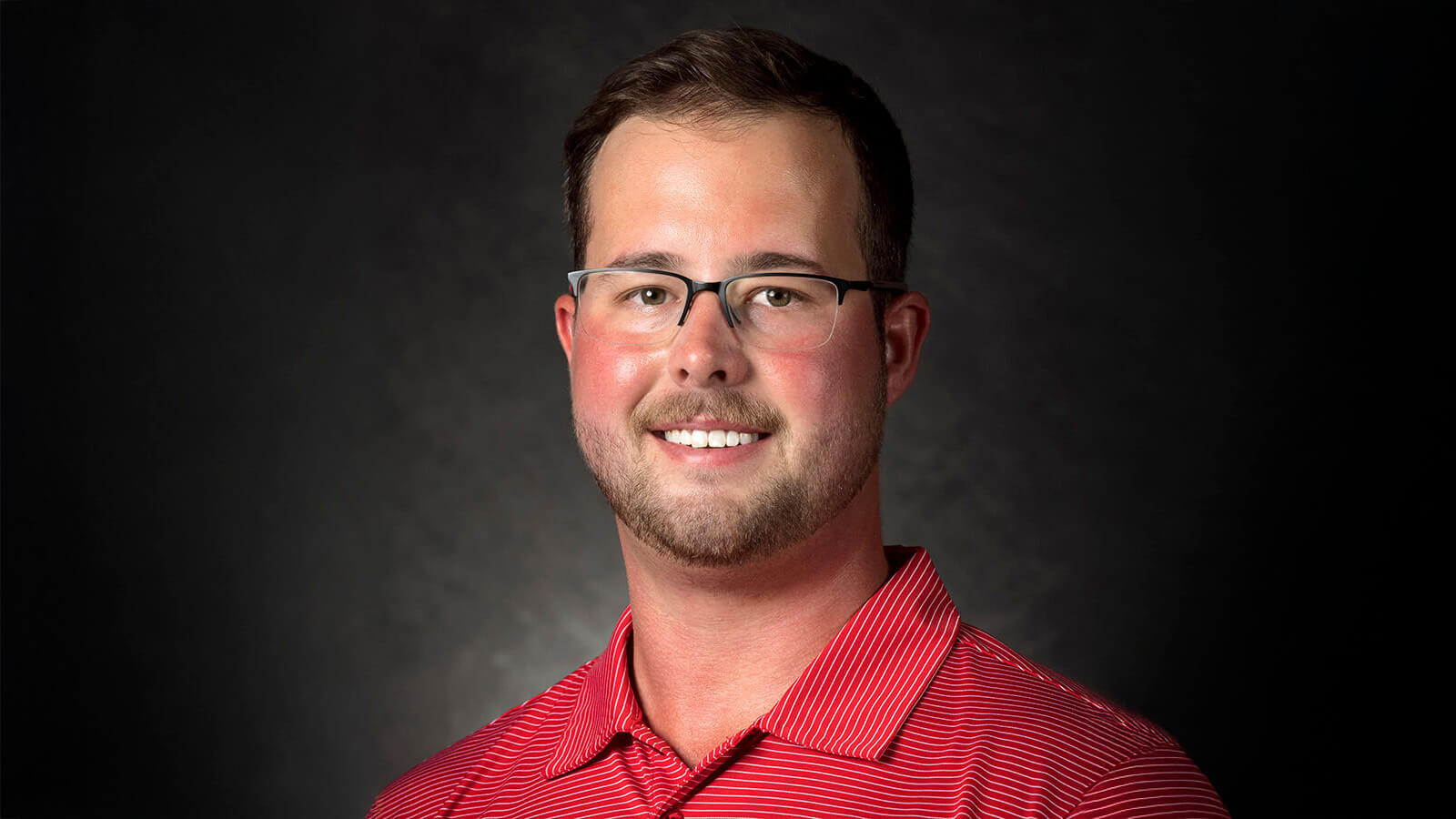 Portrait of Connor Biehler, with a textured photography screen in background