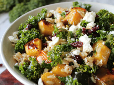 bowl of a salad made from acorns, squash, cranberries and kale
