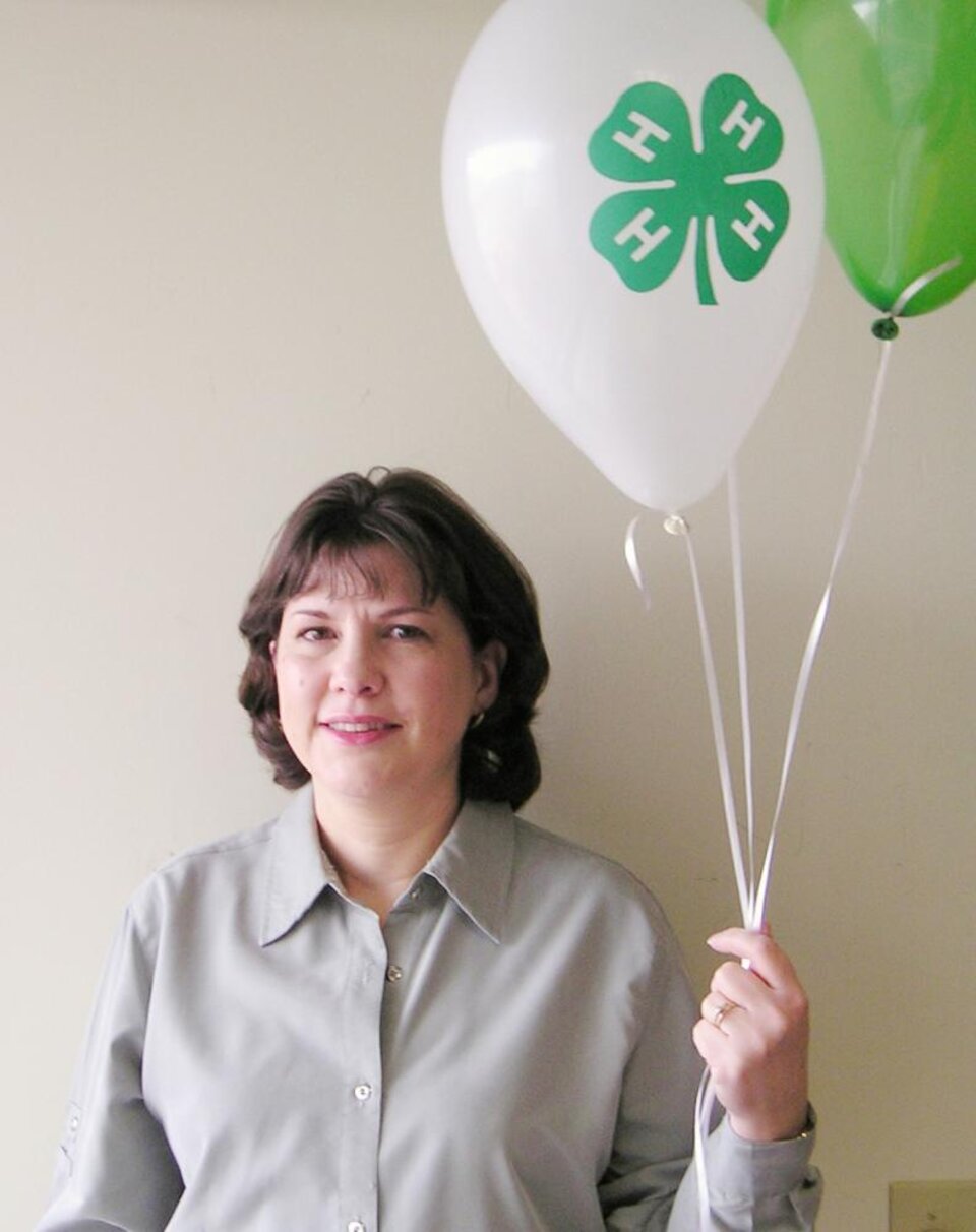 Cathy Hurdle holding balloons 