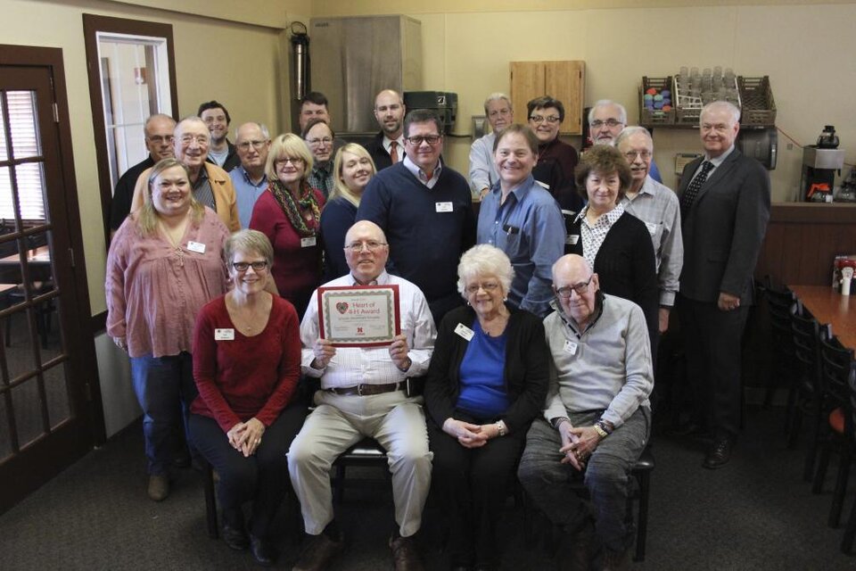 Northeast Kiwanis standing as a group and holding a certificate. 