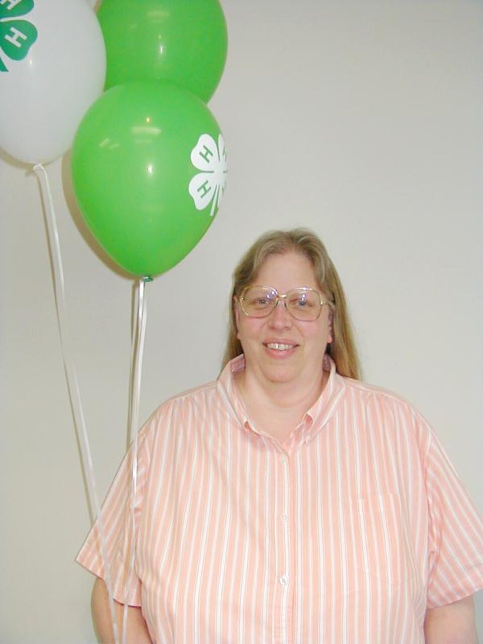 Ruth Lantis holding balloons. 