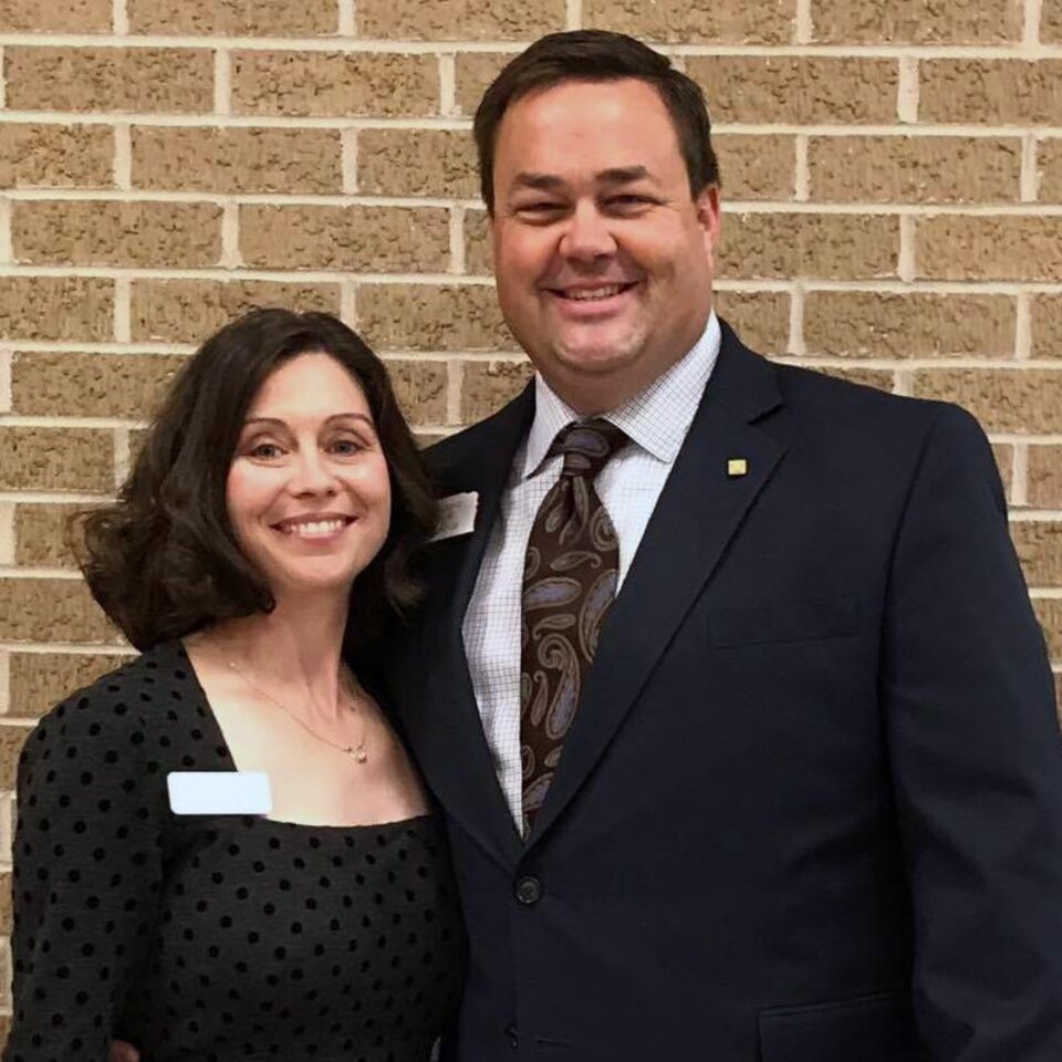 Tim & Jenny Higgins standing next to each other. 